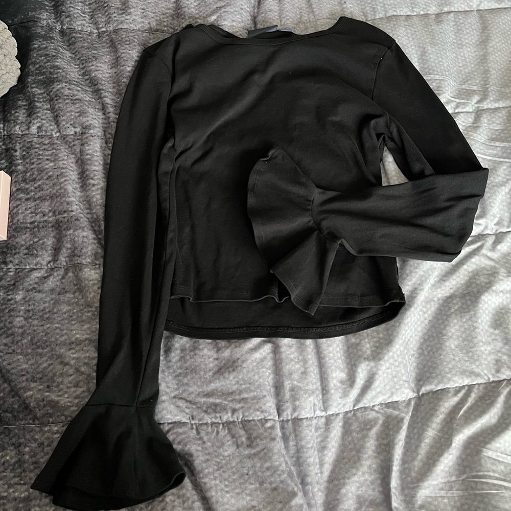 Anthropologie Black top with fun sleeves!